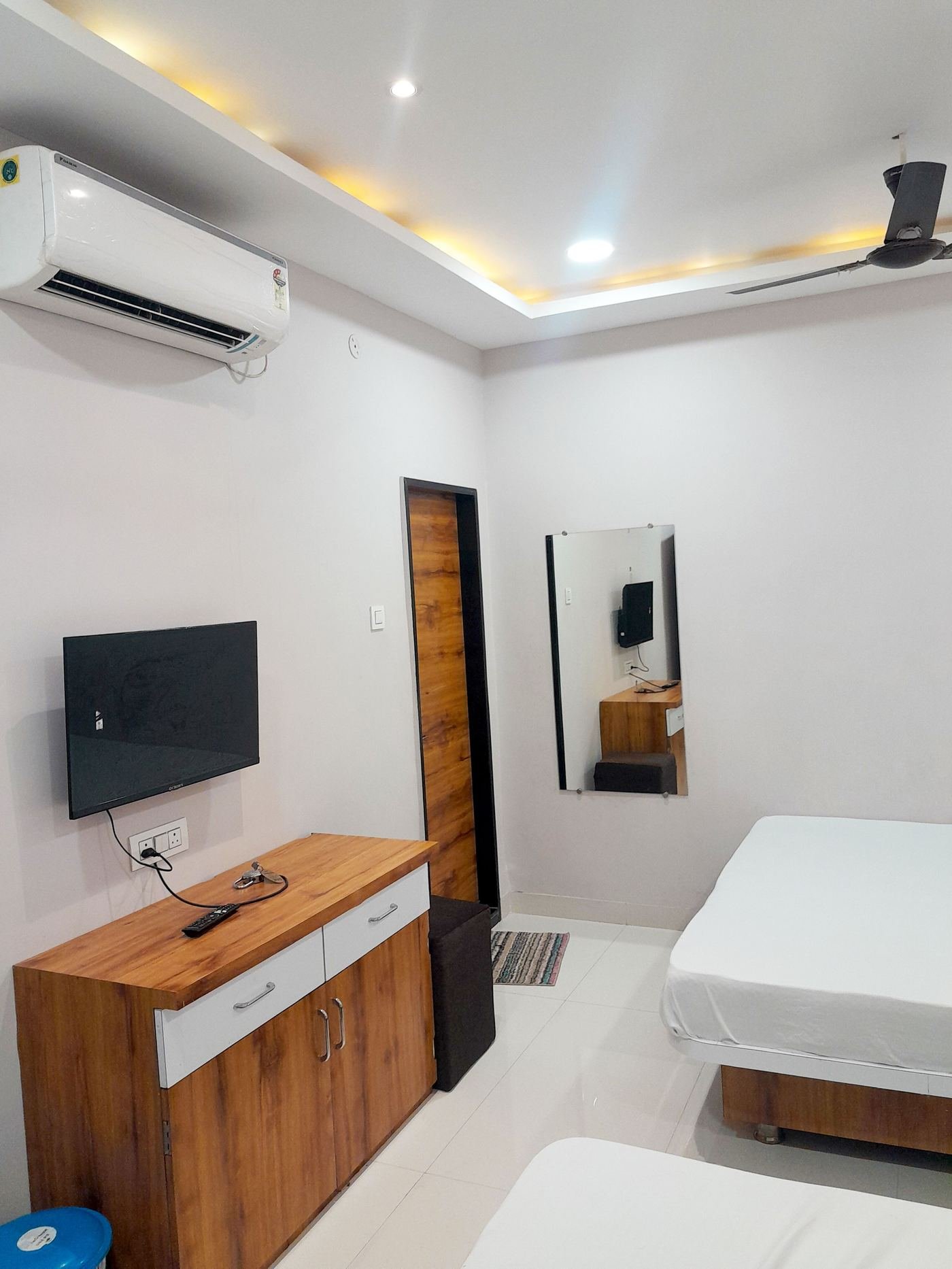 Room with LED TV and air conditioning unit